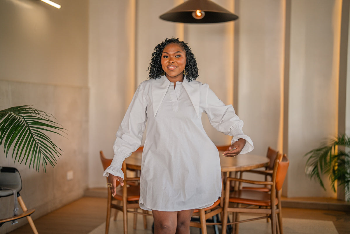 Waist-up view of the white CHETU shirt dress