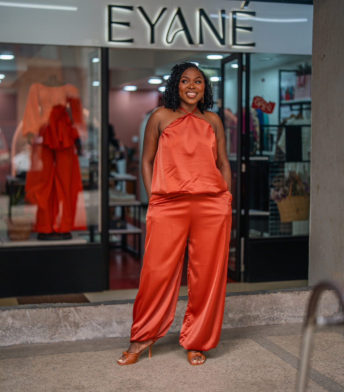 Terracotta Maputo top and pants set, full-length front view outside Eyane Africa Westlands store