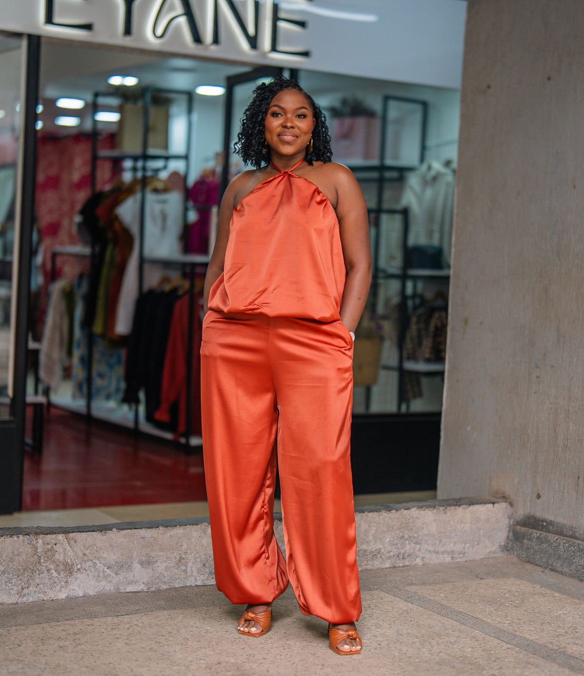 Terracotta Maputo top and pants set, full-length front view outside Eyane Africa Westlands store