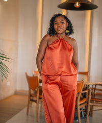 Terracotta Maputo top and pants set, full-length front view at a restaurant