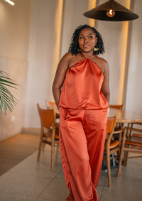 Terracotta Maputo top and pants set, full-length front view at a restaurant