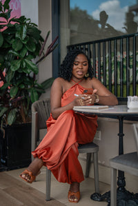Terracotta Maputo top and pants set, seated, front view