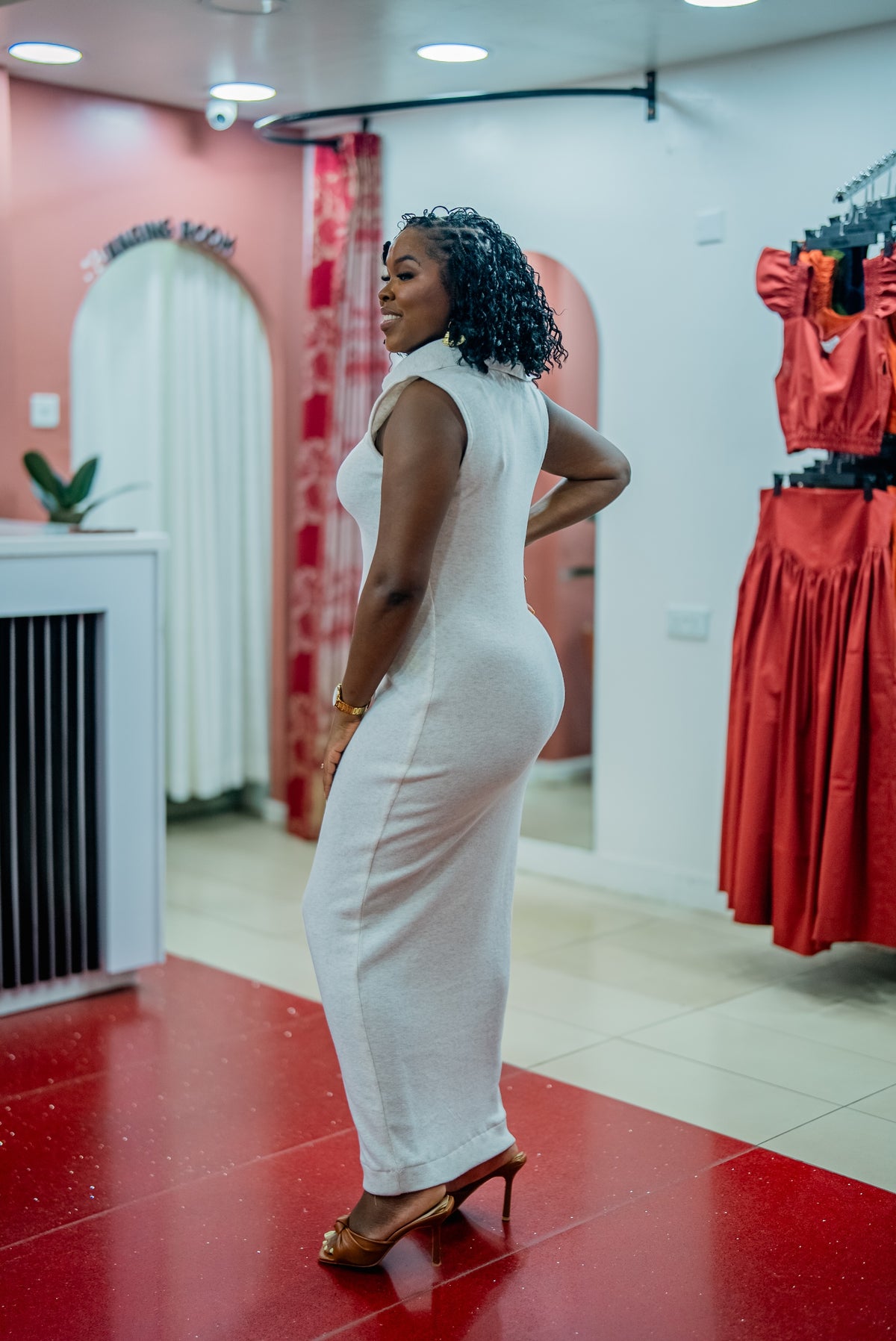 Side view of the beige Msimu knit maxi dress