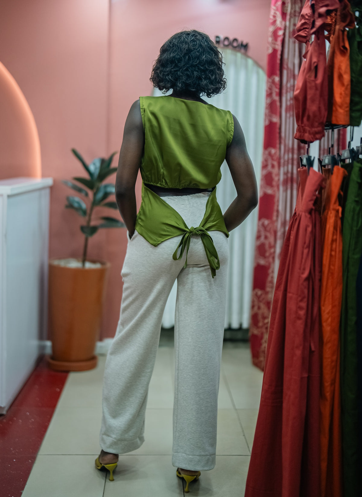 Olive green Tia top with the gray Msimu pants, back view