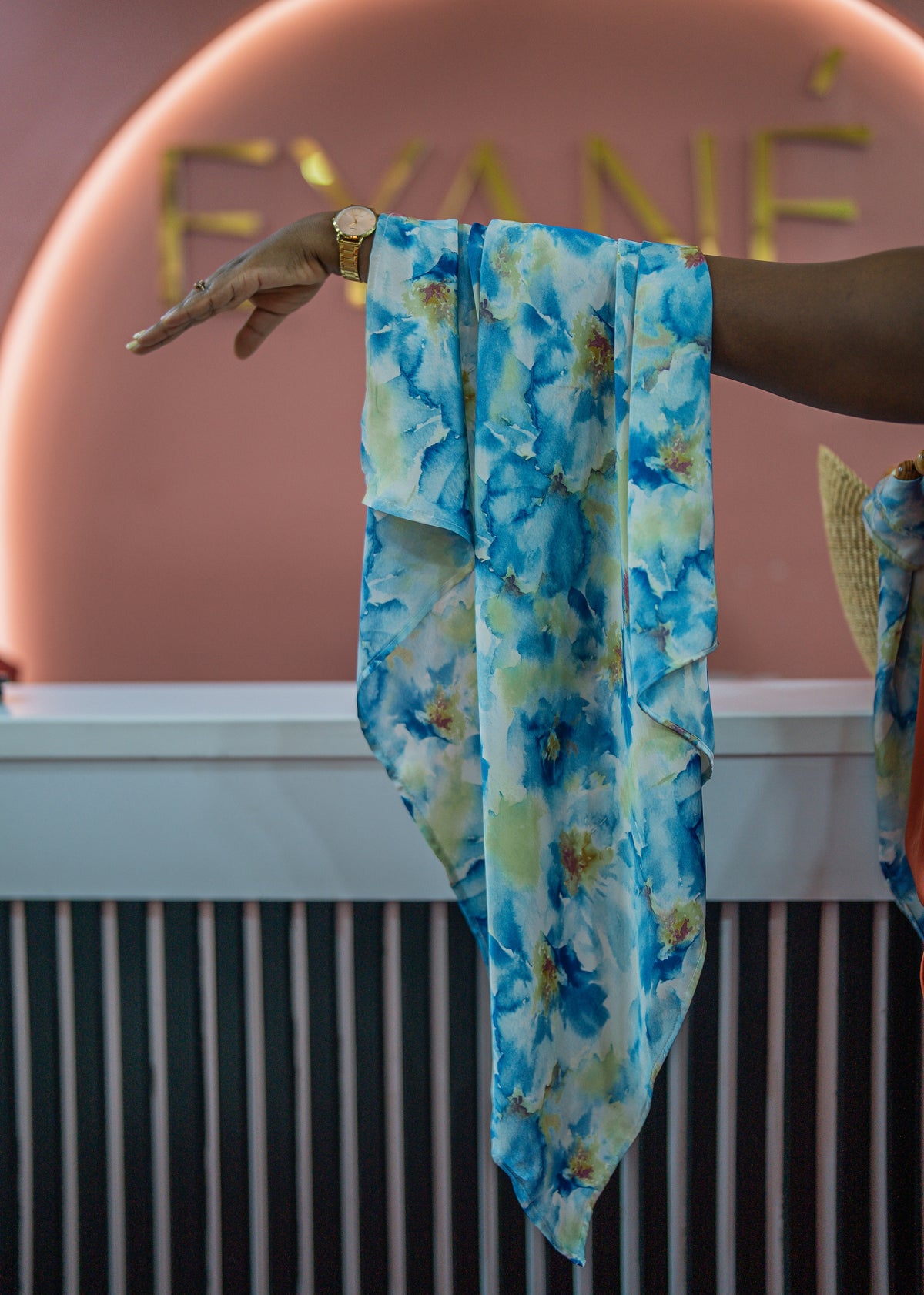 Lana scarf draped over an arm