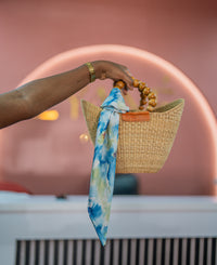 Lana scarf tied on a bag handle