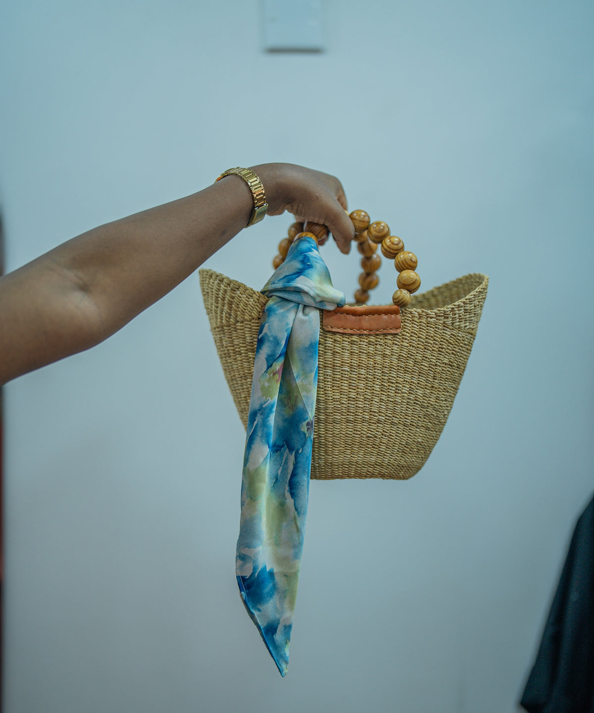 Lana scarf tied on a bag handle