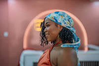 Lana scarf tied on the head, side view
