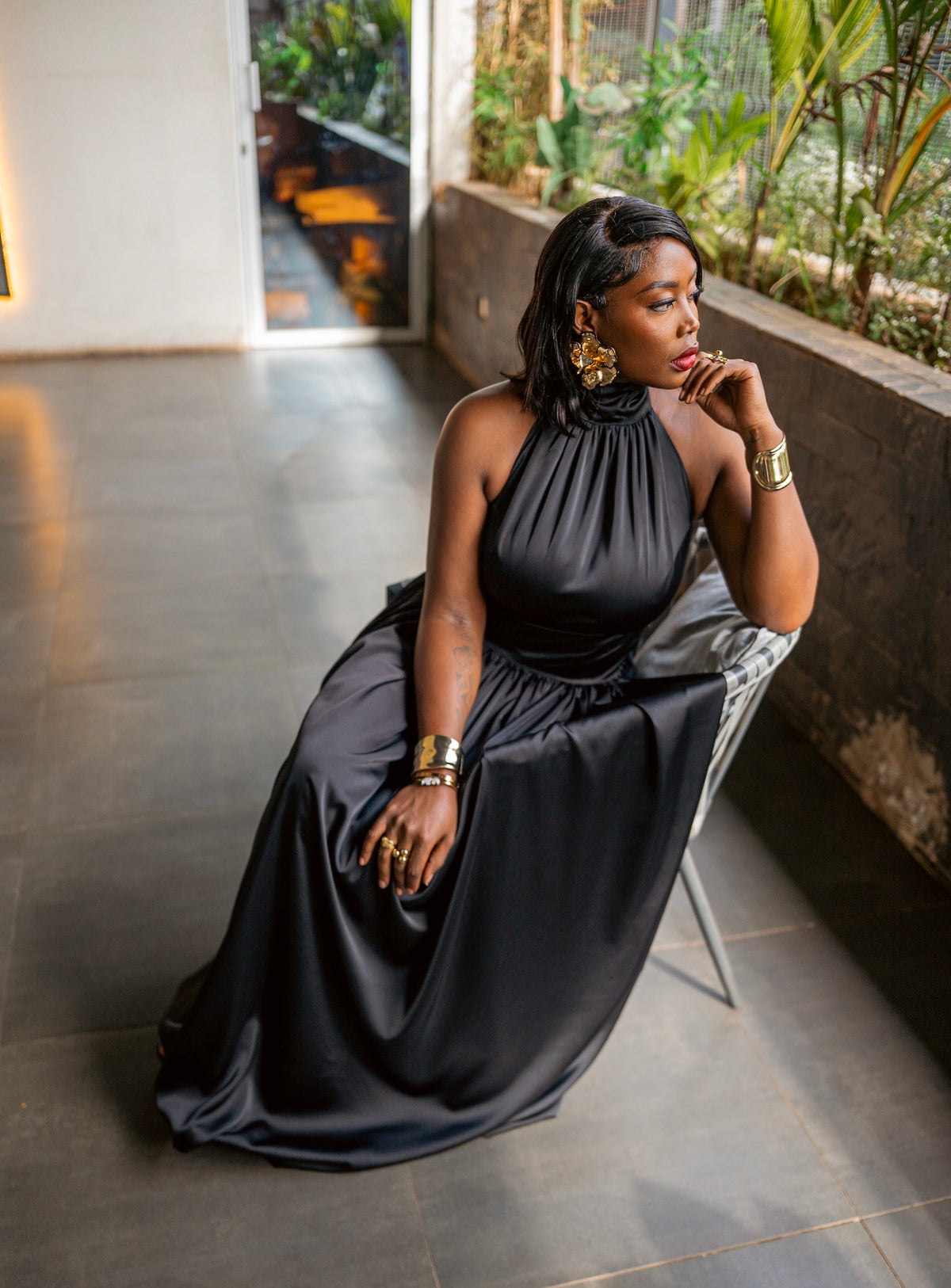 Black Tia maxi dress, seated, front view