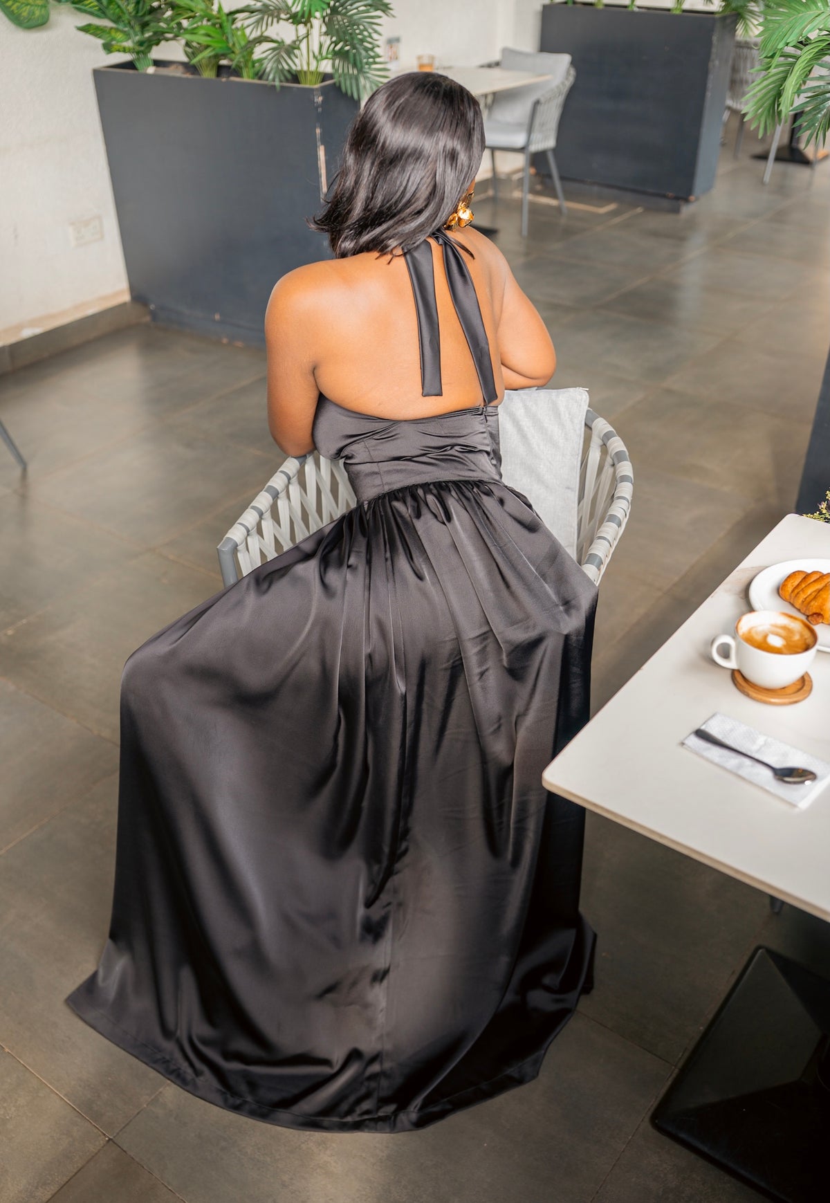 Black Tia maxi dress, seated, back view