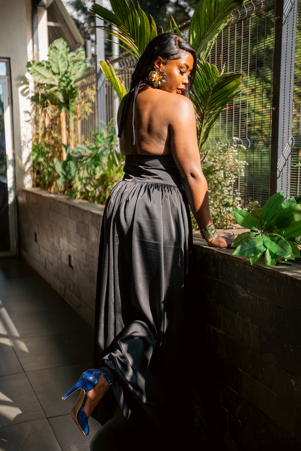 Black silky Tia maxi dress, full-length front view, standing back